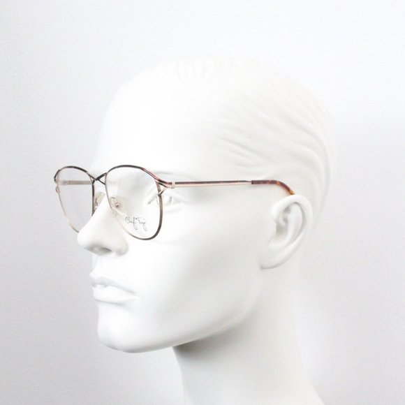 Cheryl Tiegs 80s vintage glasses model 69 made in Italy. Elegant slim gold eyegl